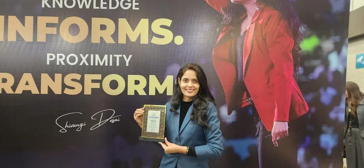 Namrata Khatri with certificate and award